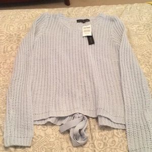 Cute sweater with laced up back